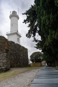 Detailed view of the San Francisco Javier Convent ruins and the Colonia del Sacramento lighthouse in Uruguay, showcasing the historic stone structure and colonial architecture.