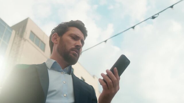 Upset Caucasian business man frustrated mobile phone no signal outdoors city street confused businessman male WiFi annoyed guy entrepreneur checking network bad connection online error downtown office