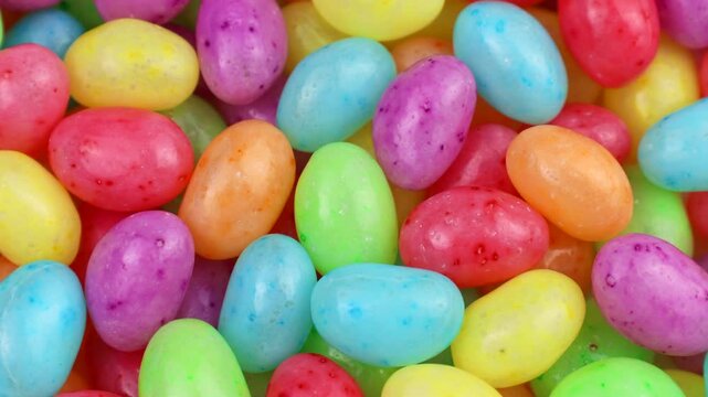 Bright colorful fruit jelly beans circle rotation close up