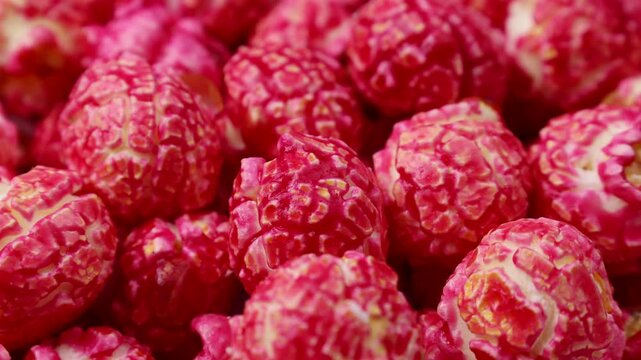 Bright red cherry cinnamon popcorn circle rotation close up