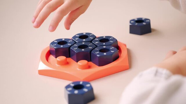 girl solving logic puzzle, Children hands playing with educational math STEM game using pieces learning number composition seven practicing logic thinking fun cognitive activity and math skills