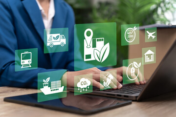 Fototapeta premium Green logistics concept, Businesswoman Promoting Green Logistics and Sustainable Transport with Clean Energy, Electric Delivery Systems, Net Zero Carbon Supply Chain for Environmental Protection