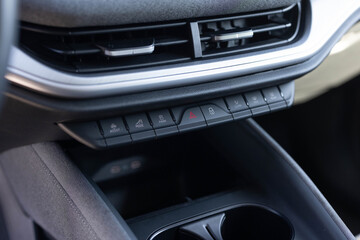 Electric car control panel. Heated seat dashboard in a car. SOS button in a car. Zone climate control. Car interior detail