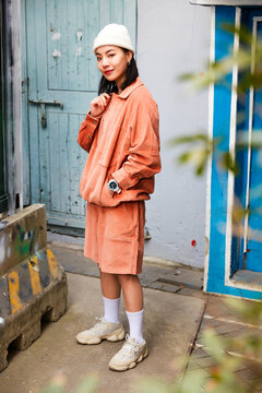 Asian fashionista in red on the street