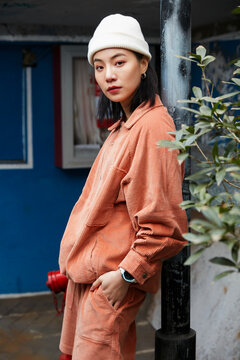 Asian fashionista in red on the street