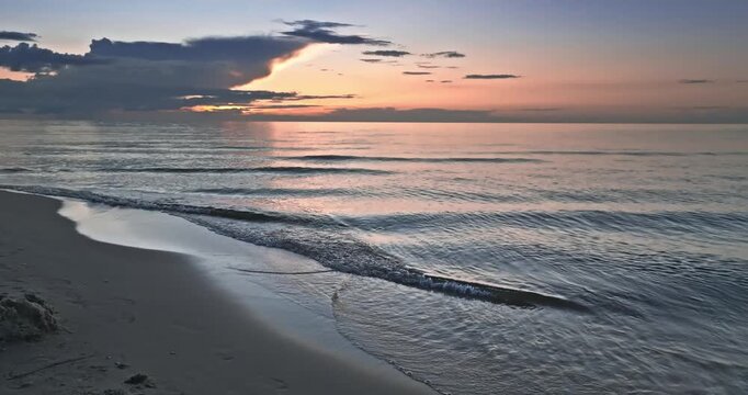 Calm golden sunset over Batlic sea in summer.