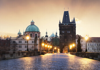 Fototapeta premium Charles Bridge over River Vltava at dramatic sunrise in Prague, Czech Republic, Europe