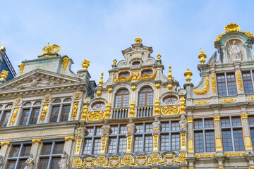 Fototapeta premium Baroque facades with ornate golden details on Grand-Place (Grote Markt) in Brussels, Belgium. Traveling through Europe. Bruxelles capital city sightseeing. La Brouette, Le Sac, La Louve guild houses