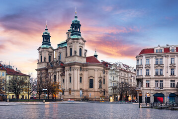 Fototapeta premium View at the Saint Nicholas Church Staromestske square in centre of Prague Old Town at sunrise. Nobody