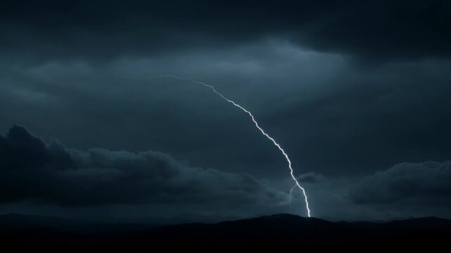 Dramatic clouds and lightning strikes over ocean landscape during daytime