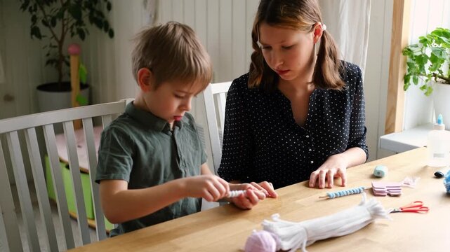 Happy Children Laugh and Fun Make DIY Toys. Kids Crafting from Fluffy wire, Bending Plush. Craft Pipe Cleaners. Leisure on Holidays. Thick Fluffy Chenille Stems for Arts. Supplies, Chenille Stems.