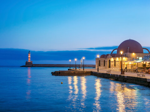Kucuk Hasan Mosque and Venetian Lighthouse at dawn, City of Chania, Crete, Greece