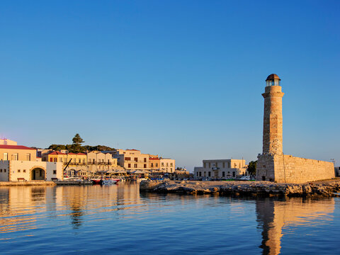 Lighthouse at the Old Venetian Port at sunrise, City of Rethymno, Rethymno Region, Crete, Greece