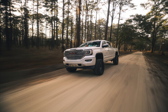 GMC Denali truck driving down a dirt road in Beaufort, South Carolina, march 1, 2026