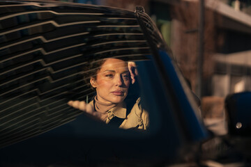 Woman traveling in car reflecting thoughtful moment © Jelena