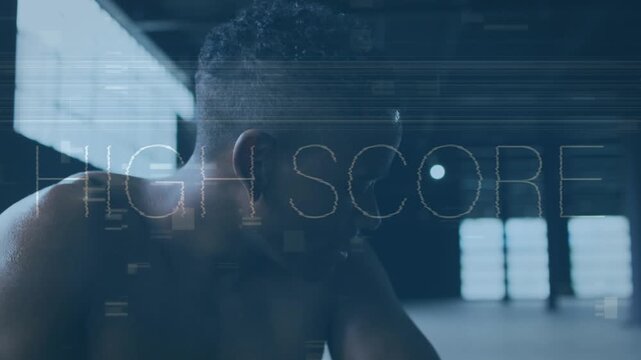 Animation of data processing and motivating texts over afrcan american fit man exercising at gym