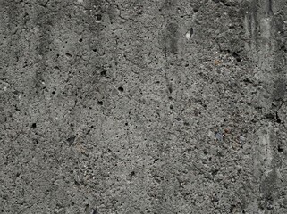 Gray concrete wall texture with small aggregate and imperfections