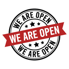 Fototapeta premium Circular sticker with a red ribbon stating we are open in bold text
