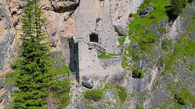 Aerial view of Wolkenstein fortress ruins in Selva di Val Gardena. South Tyrol, Italy