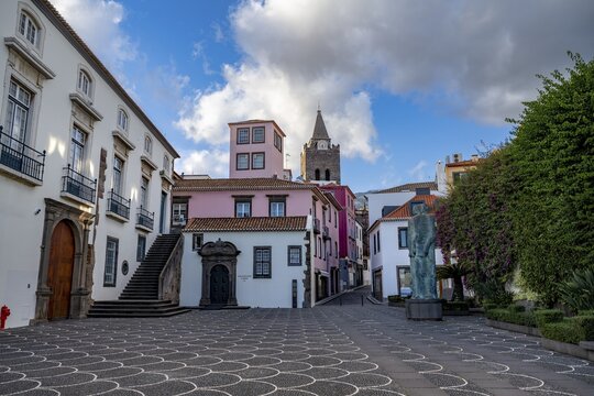 Small square in the old town with colourful houses and chapel Capela de Santo Antonio de Mouraria, tower of the church S&eacute; do Funchal in the back, Funchal, Madeira, Portugal