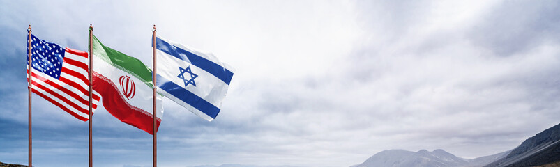 Fototapeta na wymiar National flags of USA, Iran, and Israel waving side-by-side against an overcast sky and mountain background. Dramatic composition with wide copy space for political or global themes