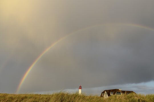 Lighthouse List-ost, in dune landscape with rainbow, Ellenbogen, List, island Sylt, Germany
