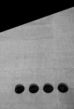 Black and white, concrete fa&ccedil;ade with round windows, Swiss National Museum, Zurich Auditorium, modern architecture, Zurich, Switzerland