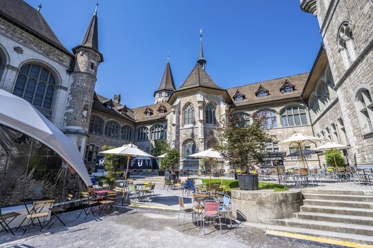 Inner courtyard, garden courtyard with tables and chairs, Swiss National Museum, Zurich, Switzerland