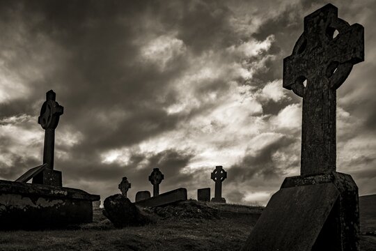 Black and white, Creepy old grave crosses with cloudy sky, Dingle Peninsula, Kerry, Ireland