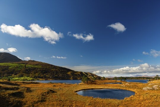 Lough Cloonee with cloudy sky in autumn landscape, Kenmare, County Kerry, Ireland