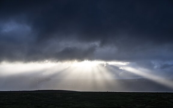 Sunbeams shine through clouds, Iceland