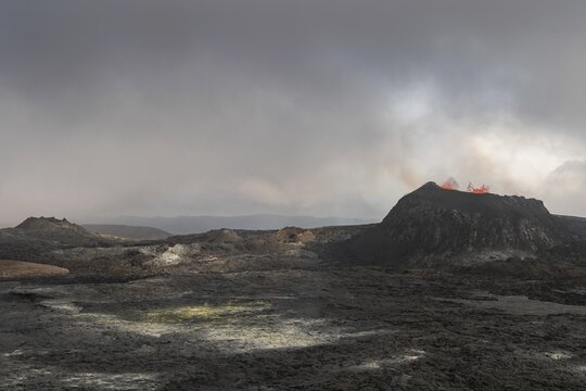 Lava spurting out of craters, sulphur deposits and cooled lava flows, active table volcano Fagradalsfjall, Kr&yacute;suv&iacute;k volcano system, Reykjanes Peninsula, Iceland