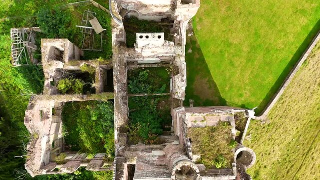 Stunning wide-angle drone footage of Redcastle, a medieval ruin in the Black Isle, Inverness, Scotland, overlooking the scenic Beauly Firth coastline.
