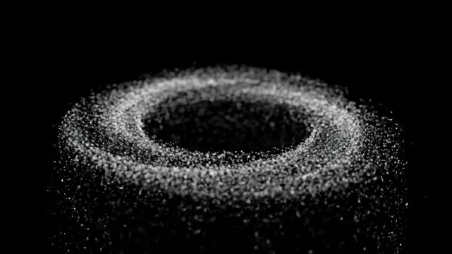 Glowing white particle circle on dark background with empty space