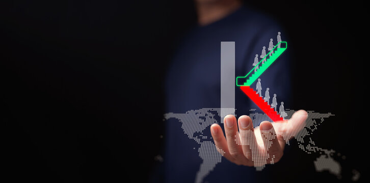 K-shaped economic recovery concept. A man holds a K-shaped escalator graph of divergence between high-growth and low-growth sectors or industries. Uneven thrive and decline global economy rebound,