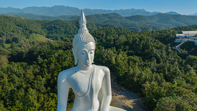 Located in the mountains of Phrae Province, Wat Phra That Pu Jae is an ancient Buddhist temple known for its square stupa containing a sacred relic of the Buddha. This peaceful heritage site reflects