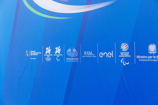 Cortina D Ampezzo, Italy - March 07, 2026: Logos of sponsors and organizers for the Paralympic Winter Games displayed on a blue backdrop, featuring Olympic and Paralympic symbols