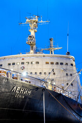 Fototapeta premium Murmansk, Russia - February 8, 2026: Lenin, Soviet nuclear-powered icebreaker, first nuclear-powered icebreaker in world docked at Murmansk port in blue winter dusk