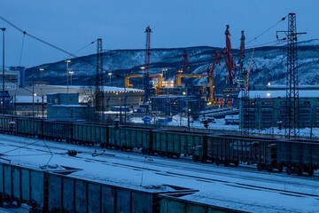 train and cranes in blue winter dusk, Murmansk