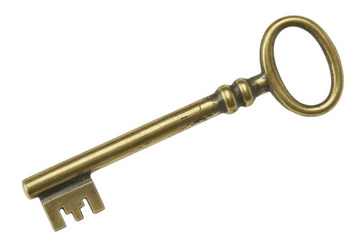 Vintage brass skeleton key on white background