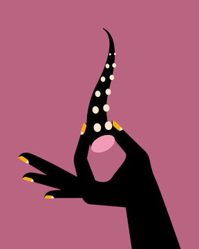 Hand holding an octopus tentacle