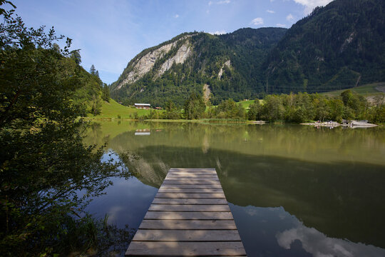 A dock leading to a lake in Kaprun, Zell Am See, Austria