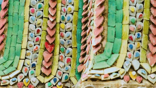 Close-up of intricate mosaic tile patterns and gilded carvings from Wat Phra Kaew, Temple of the Emerald Buddha, the most sacred Buddhist temple in Bangkok, Thailand