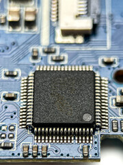 Fototapeta premium Blue Circuit Board with Microchip Close Up Isolated on White Background