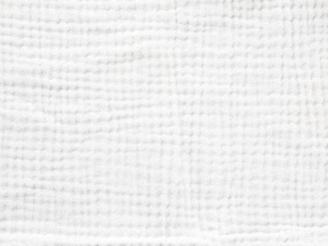 Muslin fabric texture. Background of light gray muslin fabric. Cream color muslin background close up. Design element.