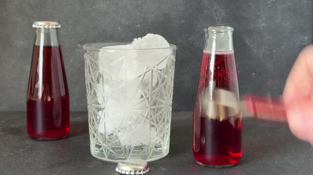 red bitter glass bottle aperitif portioned sparkling aperitif drink glass bottle tasty food background on the table top view copy space dark background marketing concept photo