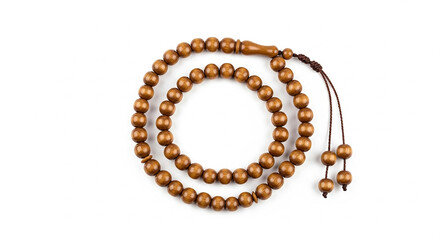 Obraz premium Close up of traditional brown wooden prayer beads coiled neatly on a clean white background emphasizing texture and craftsmanship for spiritual devotion practice.