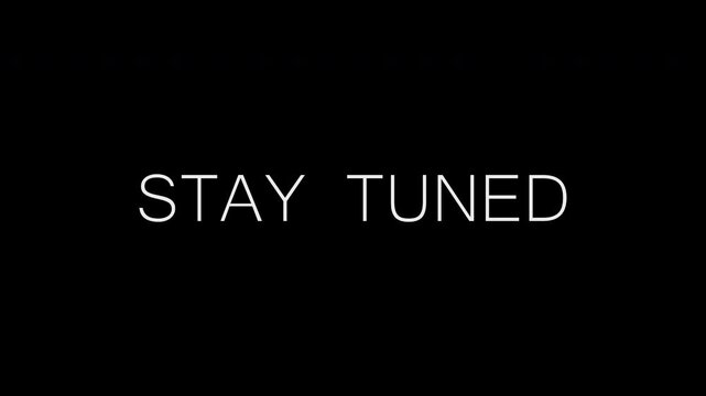 Text animation stay tuned with blurring text on a black isolated background. 4K