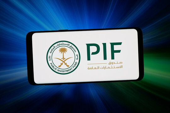 Stuttgart, Germany - 03-06-2026: In this photo illustration, the logo of wealth fund Public Investment Fund (PIF) is displayed on a smartphone in front of abstract background on computer screen.