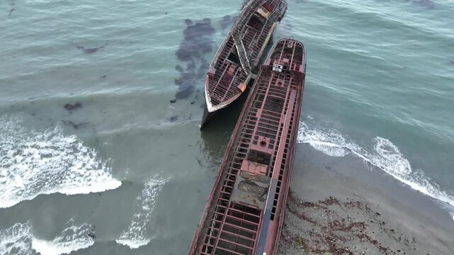 Flyover of the beached hulls of Mu&ntilde;oz Gamero (County of Peebles), Hipparchus, and Falstaff serving as a breakwater on the shores of Punta Arenas, Chile